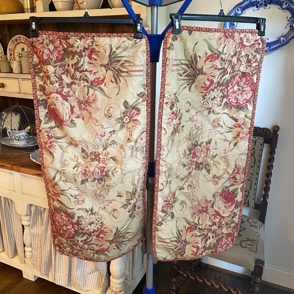 Red and brown pillow covers with zipper and cording. 35” wide 15” depth.